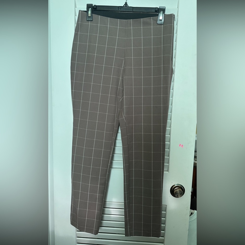 New dress pants - never worn. Taupe with white print. Zips on side.